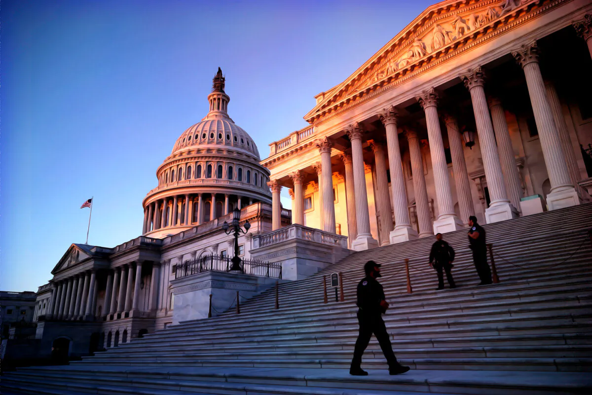 Capitol Police stand watch on the East Front of the U.S. Capitol at sunrise in Washington on Oct. 25, 2023. (Chip Somodevilla/Getty Images)