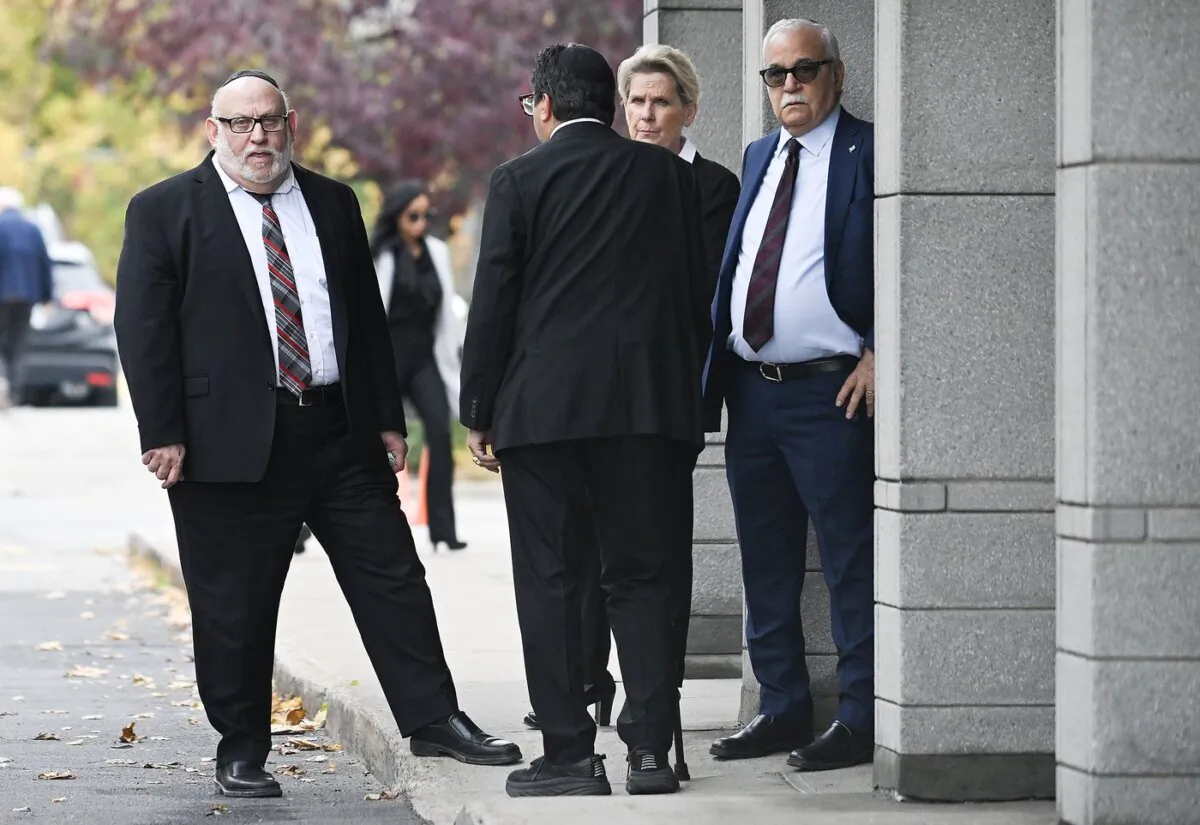 Rabbi Reuben Poupko (L) arrives for the funeral service for Alexandre Look in Montreal, on Oct. 26, 2023. (The Canadian Press/Graham Hughes)