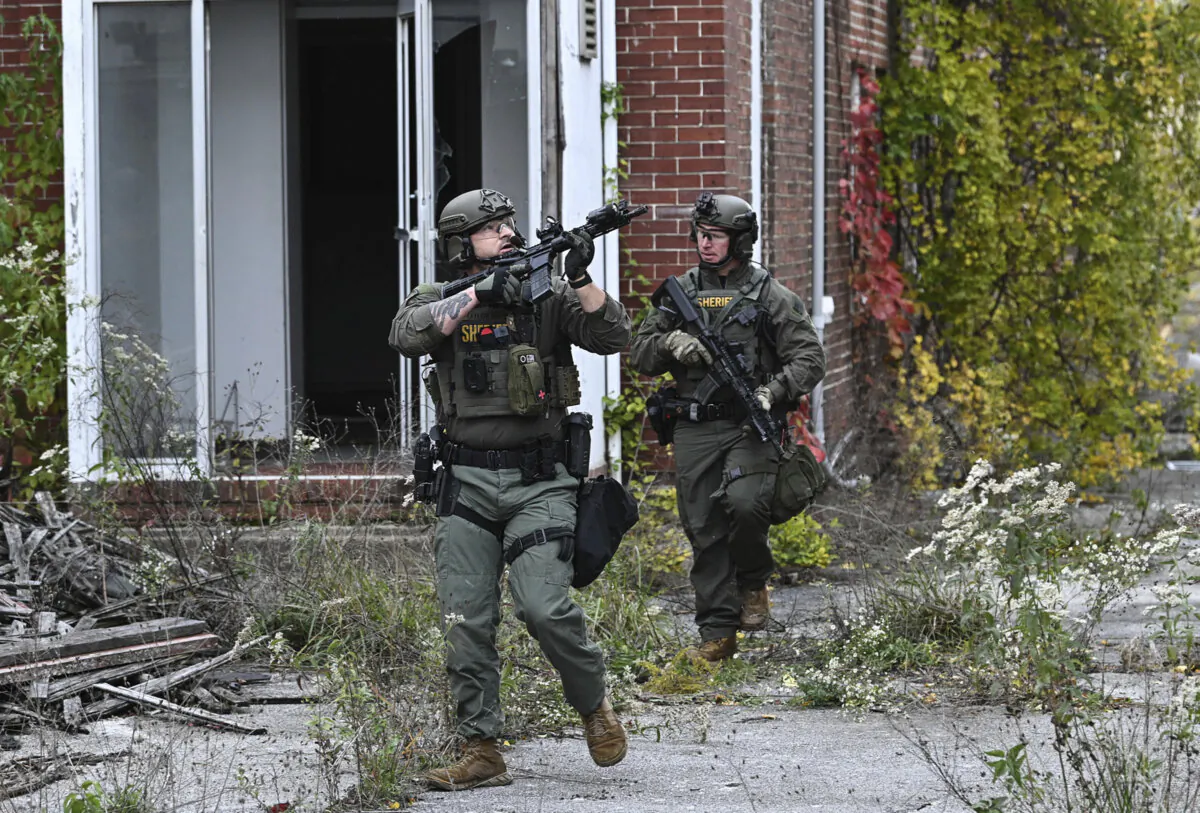 Officers with the Frederick County, Md., Sheriff's Office SWAT Team search for suspect Pedro Argote at the former Garden State Tannery plant in Williamsport, Md, on Oct. 21, 2023. (Ric Dugan/The Frederick News-Post via AP, File)