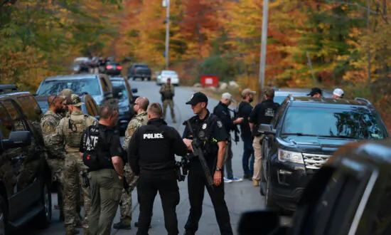 Police Surround Home in Search for Suspect in Fatal Shooting of 18 in Maine