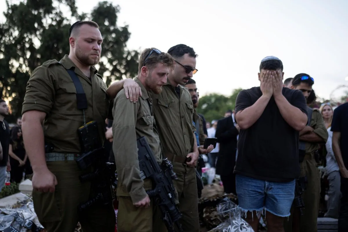 Mourners attend the funeral of Israeli man Sagiv Ben Svi, killed by Hamas terrorists while attending a music festival, at a cemetery in Holon, central Israel, on Oct. 26, 2023. (Petros Giannakouris/AP)