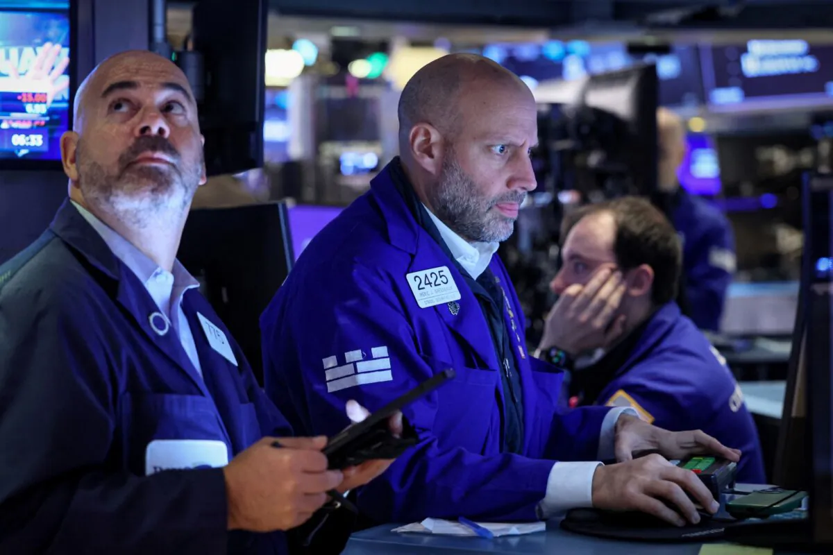 Traders work on the floor at the New York Stock Exchange (NYSE) in New York City on Oct. 26, 2023. (Brendan McDermid/Reuters)