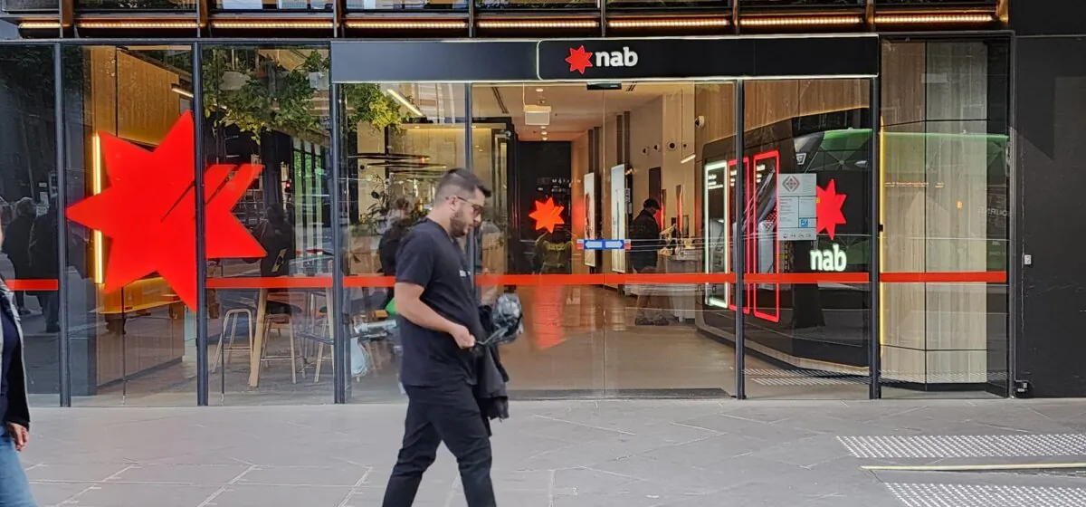 A man walks past a National Australia Bank (NAB) branch in Melbourne, Victoria, Australia, on Oct. 27, 2023. (Susan Mortimer/The Epoch Times)