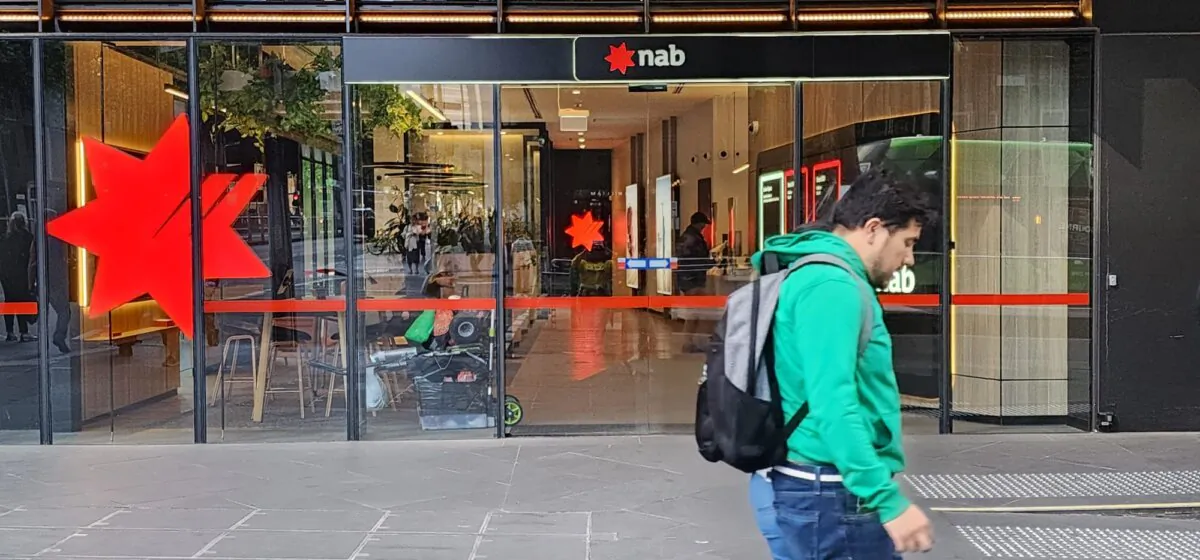 A man walks past a National Australia Bank (NAB) branch in Melbourne, Victoria, Australia, on Oct. 27, 2023. (Susan Mortimer/The Epoch Times)