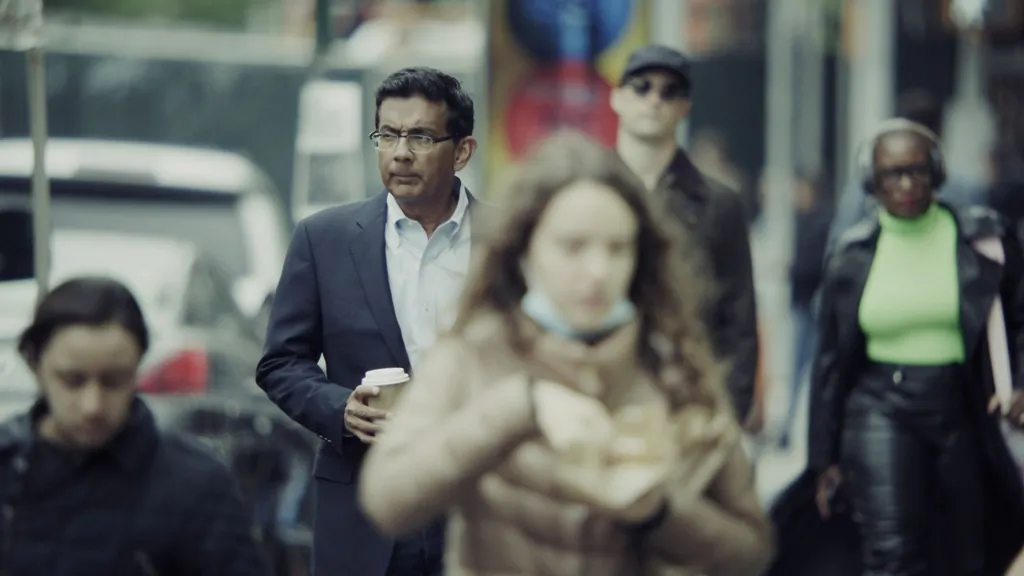 Dinesh D'Souza (L) is shown being tracked, in "Police State." (D'Souza Media)