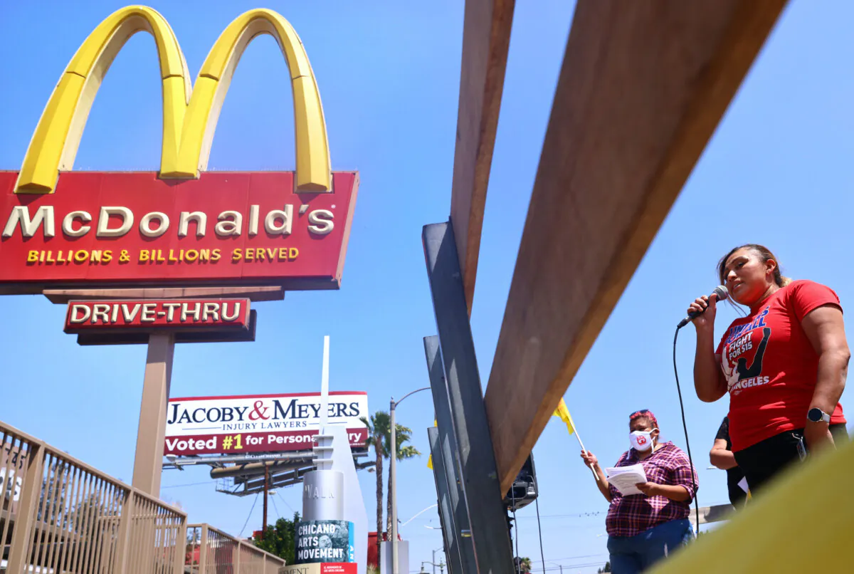 A McDonald’s employee speaks at a rally of fast food workers and supporters for passage of a fast-food worker health and safety bill in the Boyle Heights neighborhood of Los Angeles on April 16, 2021. (Mario Tama/Getty Images)