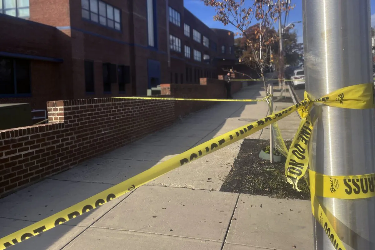 Police tape is placed outside Carver Vocational Technical High School in west Baltimore on Oct. 27, 2023. (Lea Skene/AP Photo)