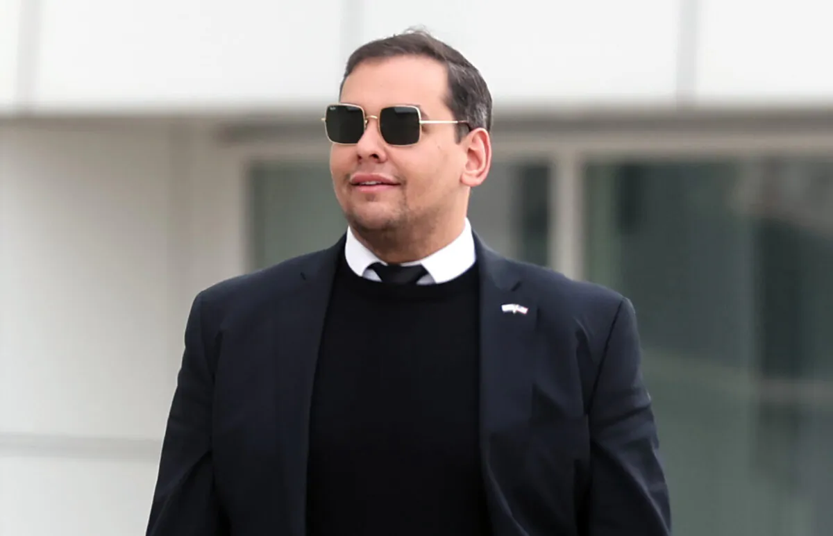 Rep. George Santos (R-N.Y.) walks out of a federal courthouse in Long Island in Central Islip, N.Y., on Oct. 27, 2023. (Spencer Platt/Getty Images)