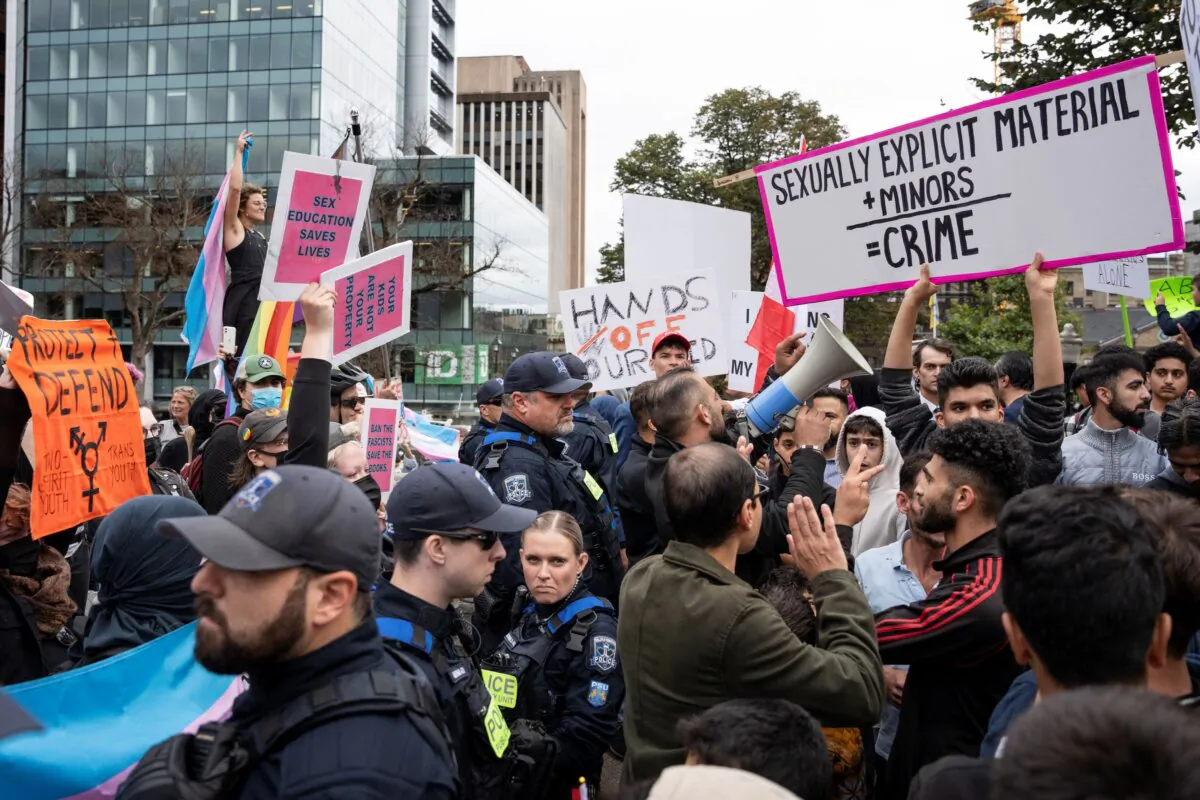 Police stand between protesters opposed to gender diversity in schools and counter-protesters in Halifax on Sept. 20, 2023.  (The Canadian Press/Darren Calabrese)