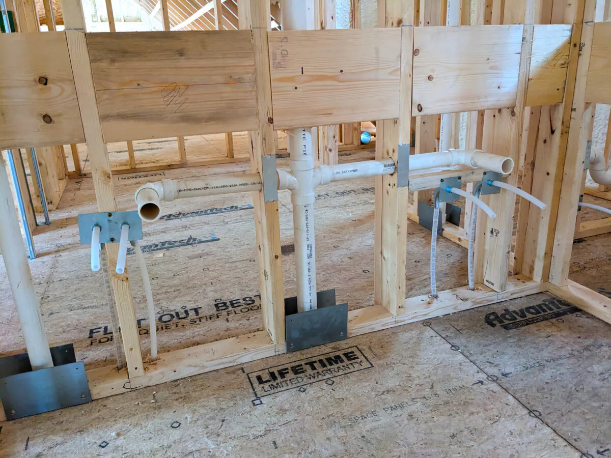 These are the drain pipes for two side-by-side sinks in a bathroom. The vertical pipe centered above the two horizontal pipes is a mysterious vent pipe. (Tim Carter/Tribune Content Agency)