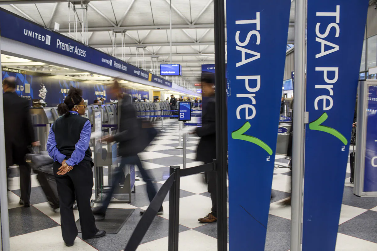 Passengers walk through the entrance of a TSA PreCheck in Terminal one at O'Hare International Airport Wednesday, Feb. 1, 2017, in Chicago. (Armando L. Sanchez/Chicago Tribune/TNS)