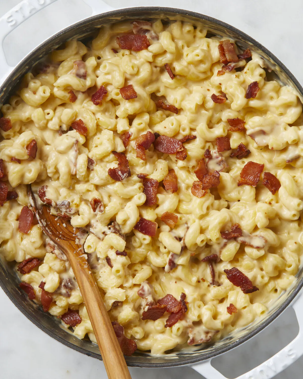 Smoky bacon punches the flavor up in this mac and cheese that doesn't skimp on the cheese sauce. (Alex Lepe/TNS)