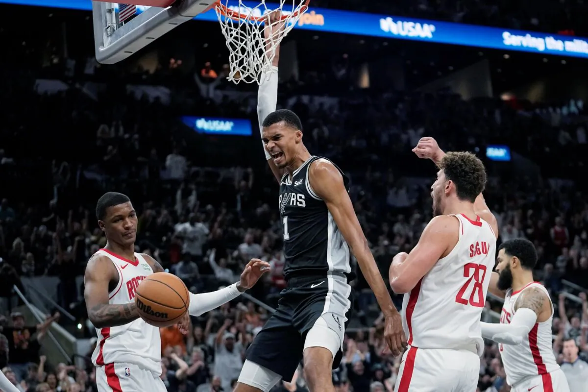 San Antonio Spurs center Victor Wembanyama (1) reacts to a play, between Houston Rockets' Jabari Smith Jr., (L), and Alperen Sengun (28) during overtime in an NBA basketball game in San Antonio on Oct. 27, 2023. (Eric Gay/AP)