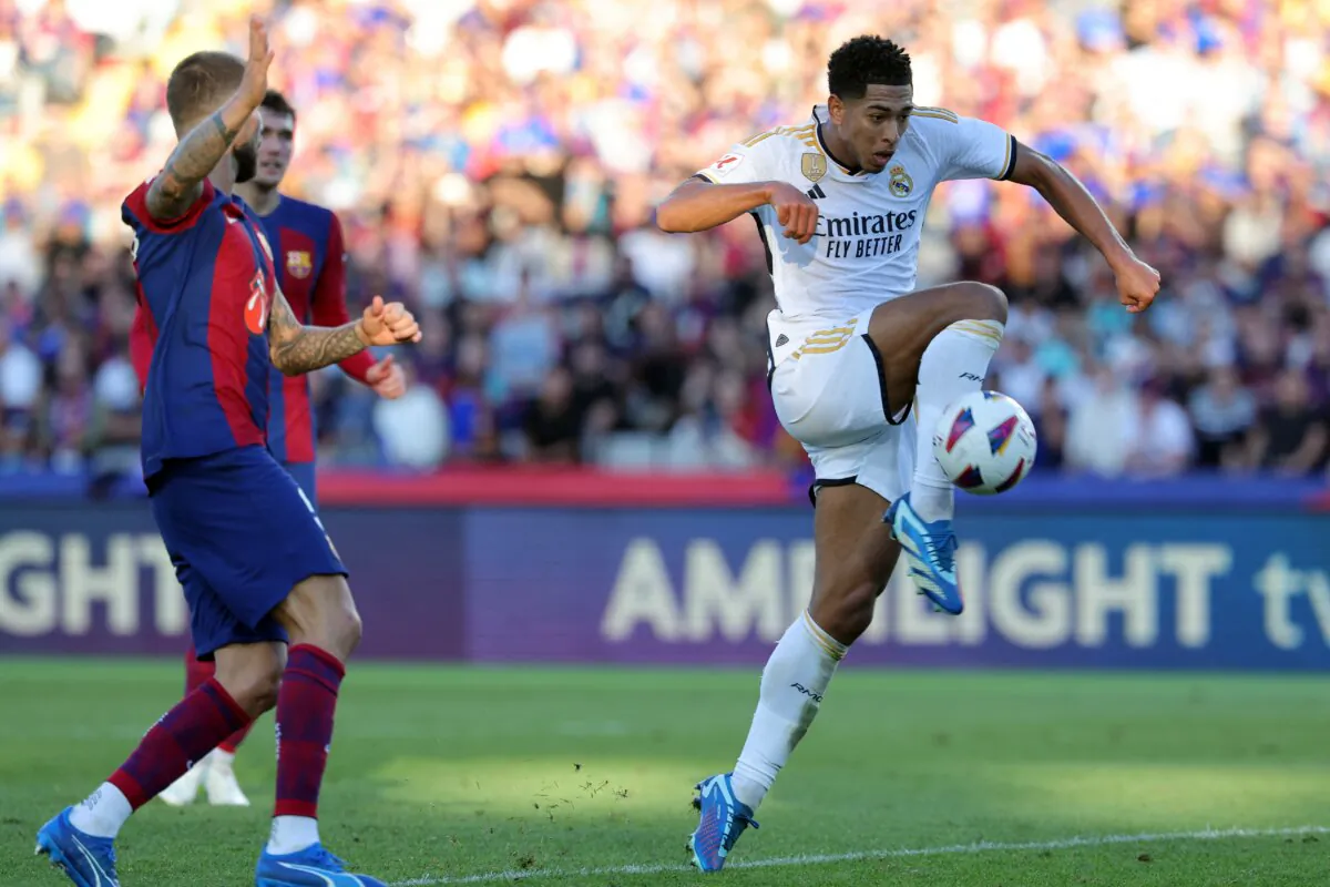Real Madrid's English midfielder (5) Jude Bellingham scores his team's second goal during the Spanish league football match between FC Barcelona and Real Madrid CF at the Estadi Olimpic Lluis Companys in Barcelona on Oct. 28, 2023. (Louis Gene/ AFP via Getty Images)