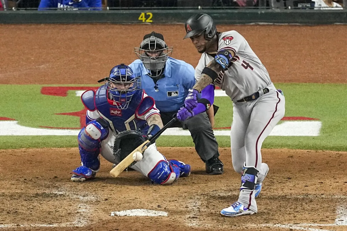 Arizona Diamondbacks' Ketel Marte hits a two-run single against the Texas Rangers during the eighth inning in Game 2 of the baseball World Series in Arlington, Texas, on Oct. 28, 2023. (Tony Gutierrez/AP Photo)
