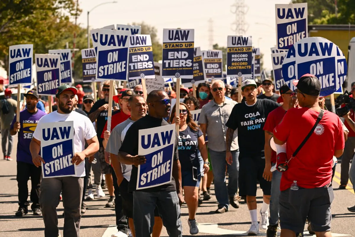 Members of the United Auto Workers (UAW) Local 230 and their supporters walk the picket line in front of the Chrysler Corporate Parts Division in Ontario, Calif., on Sept. 26, 2023. (Patrick T. Fallon/AFP via Getty Images)