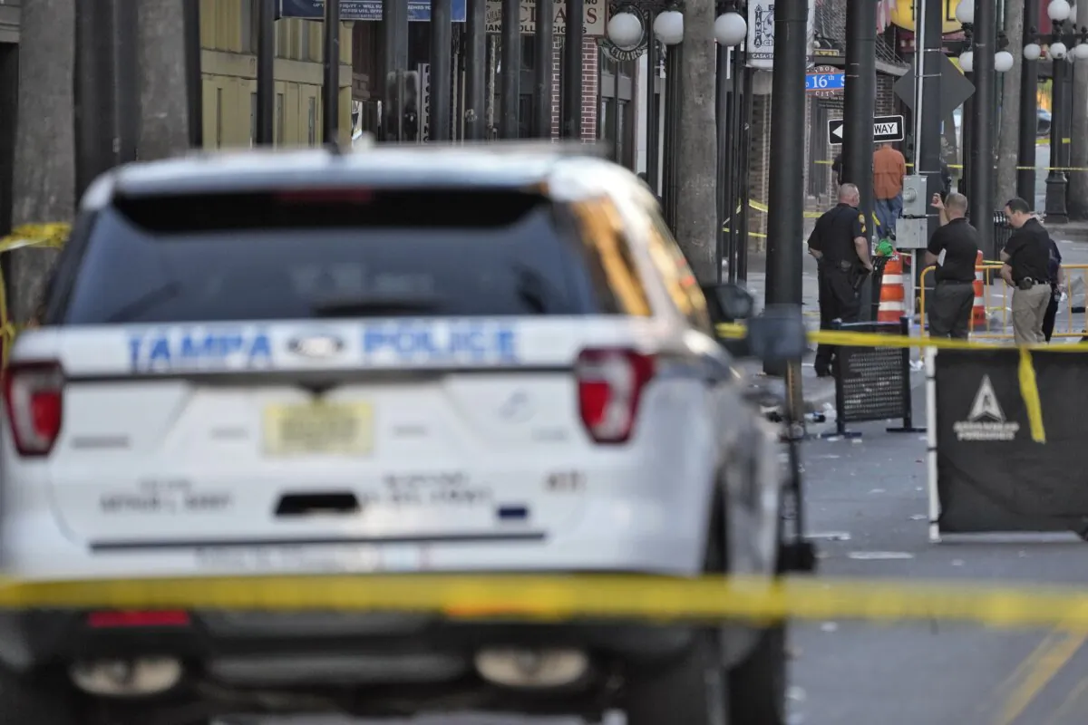 Tampa police officers stand in the street in the Ybor City of Tampa, Fla., on Oct. 29, 2023. (Chris O'Meara/AP Photo)