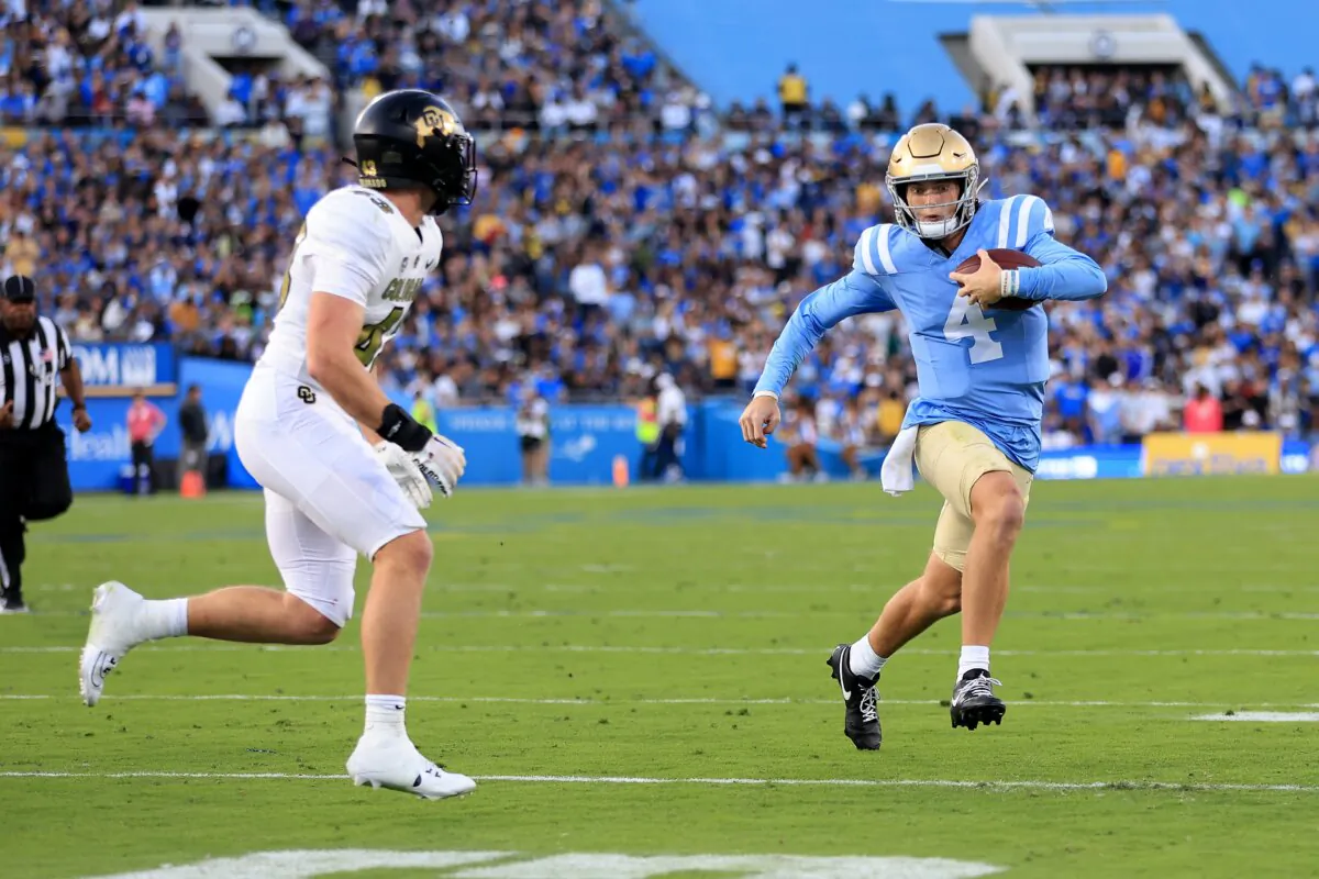 Trevor Woods (43) of the Colorado Buffaloes chases Ethan Garbers (4) of the UCLA Bruins during the first half of a game at Rose Bowl Stadium in Pasadena, Calif., on Oct. 28, 2023. (Sean M. Haffey/Getty Images)