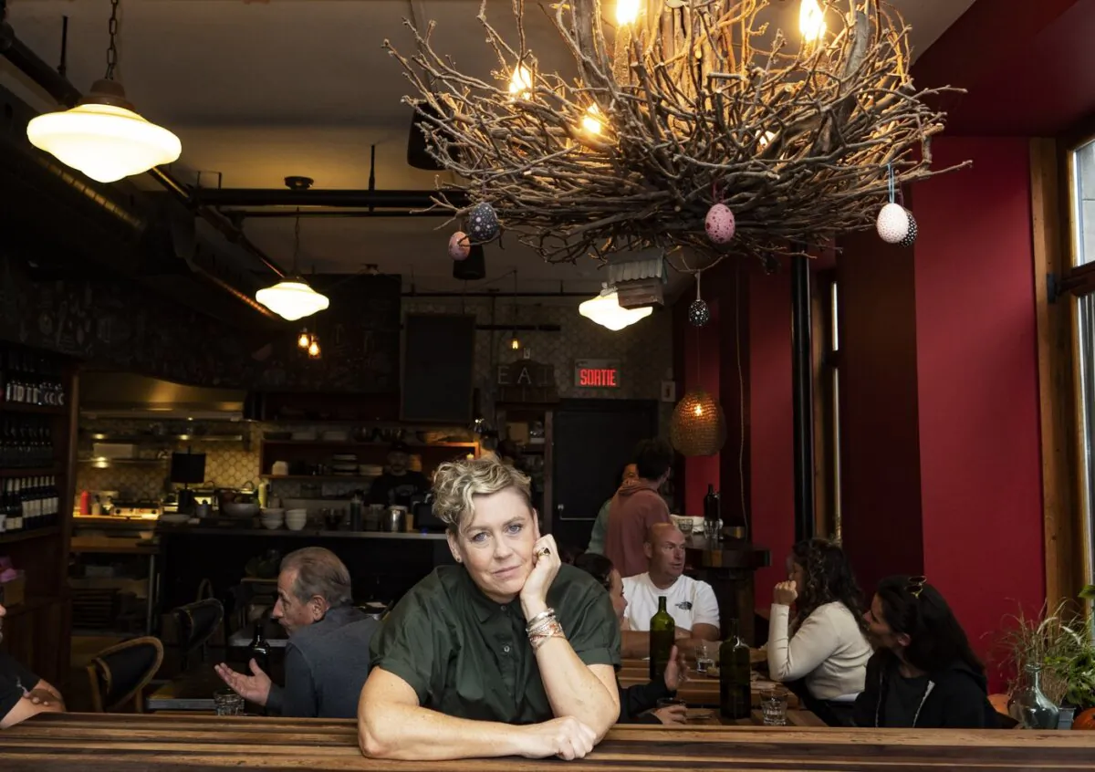 Dyan Solomon, co-founder and owner of Olive et Gourmando, poses inside the restaurant in Old Montreal on Oct. 19, 2023. (The Canadian Press/Christinne Muschi)