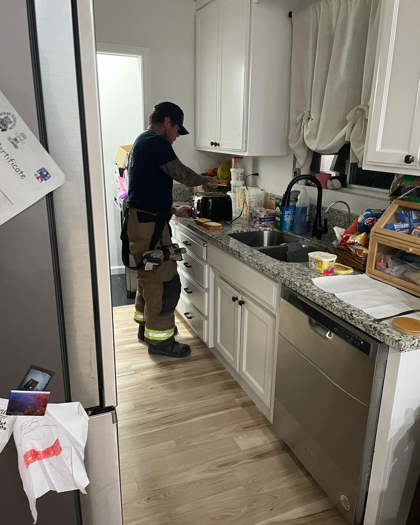 LBFD Fire Captain Brian Thompson helps makes breakfast for the three children whose mother was taken to the hospital.
