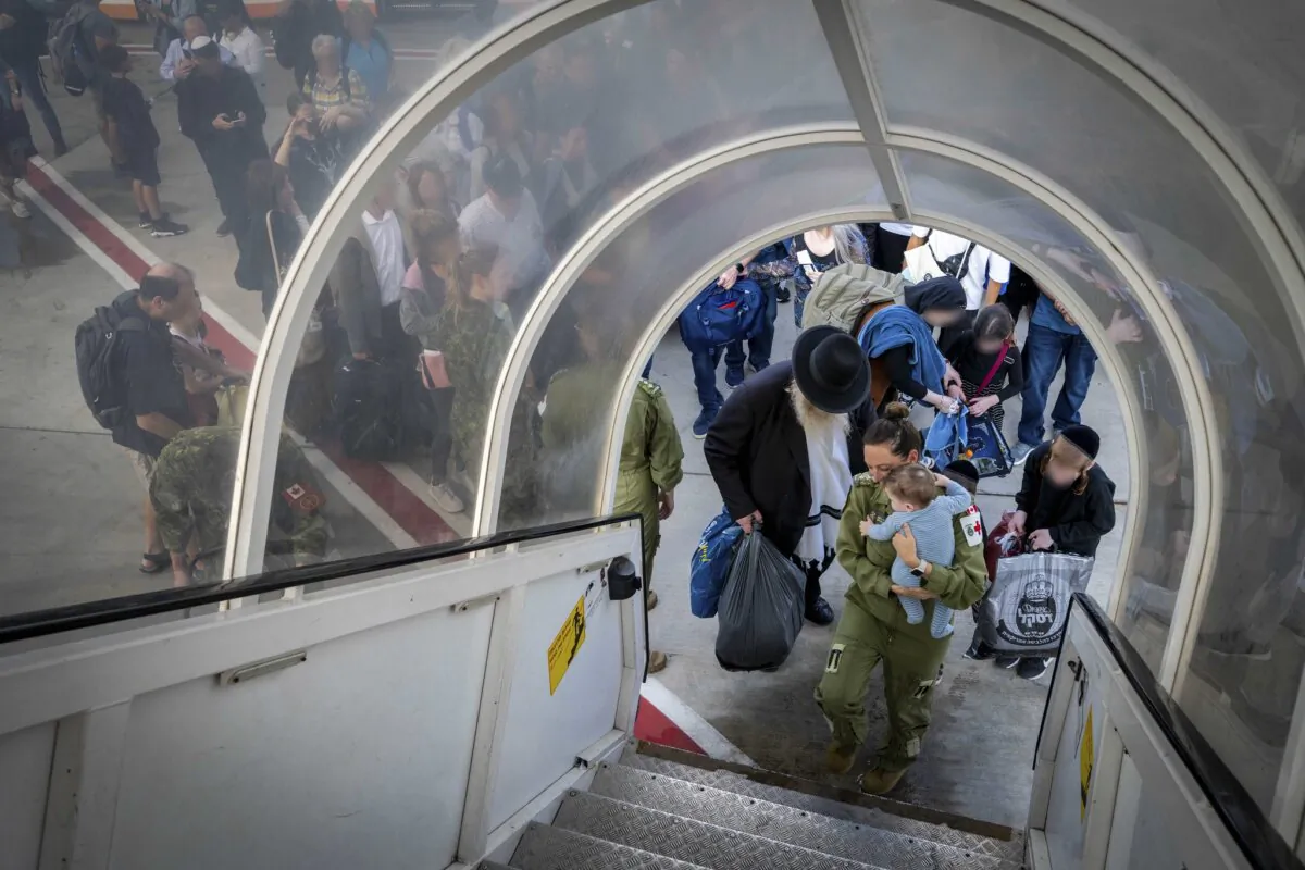 Members of 437 Transport Squadron help with the assisted departure of evacuees from Tel Aviv, Israel to Athens, Greece as part of Operation ION on 15 October 2023. (Corporal Charles Audet, Canadian Armed Forces Photo)