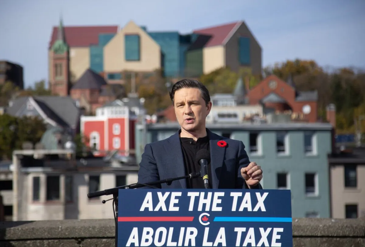 Conservative Leader Pierre Poilievre holds a press conference regarding his “Axe the Tax” message from the roof of a parking garage in St. John's,
on Oct.27, 2023. (The Canadian Press/Paul Daly)