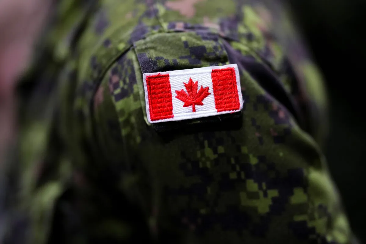 The Canadian flag is seen on a soldier's uniform at Garrison Petawawa in Petawawa, Ont., on Oct. 19, 2023. (The Canadian Press/Sean Kilpatrick)