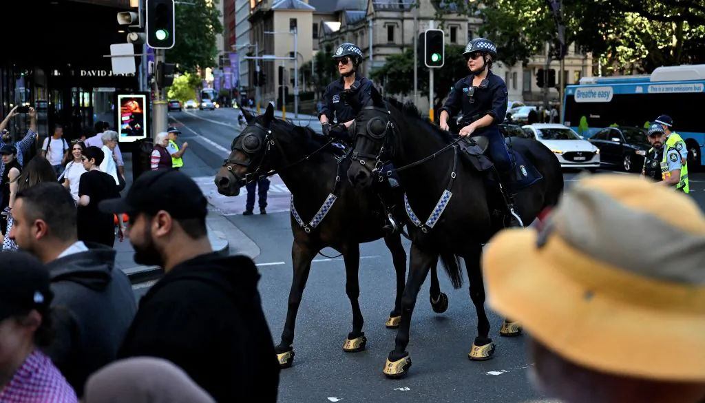 Police officers patrol during a pro-Palestinian rally in Sydney on October 15, 2023. Thousands of Palestinians sought refuge after Israel warned them to evacuate the northern Gaza Strip before an expected ground offensive against Hamas, one week on from the deadliest attack in Israeli history (Photo by Saeed KHAN / AFP) (Photo by SAEED KHAN/AFP via Getty Images)