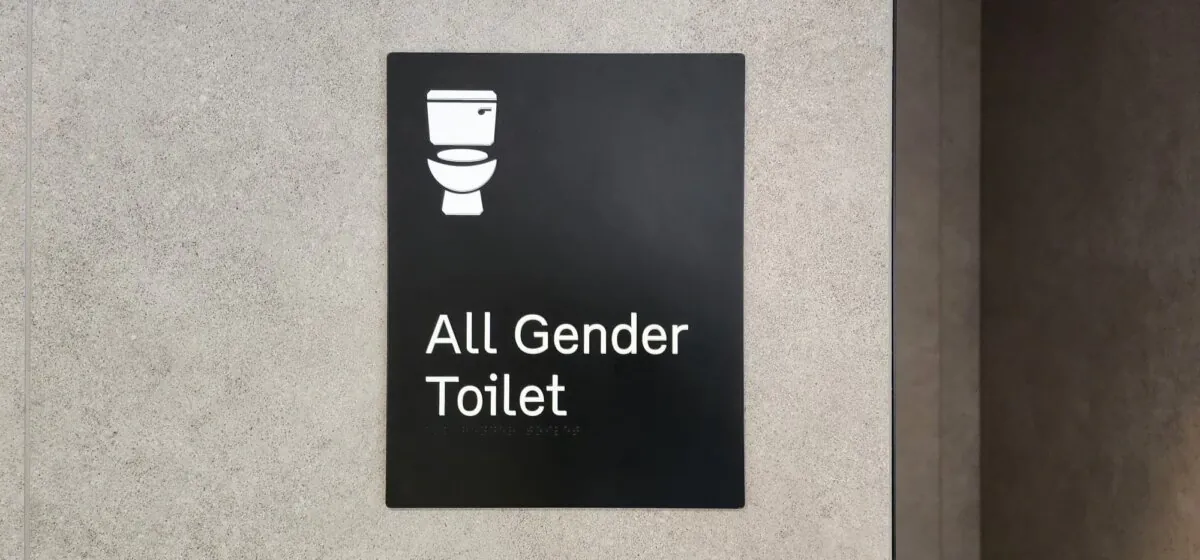 Signage denoting a unisex bathroom can be seen at Melbourne Airport, Australia, on Oct. 31, 2023. (Susan Mortimer/The Epoch Times)