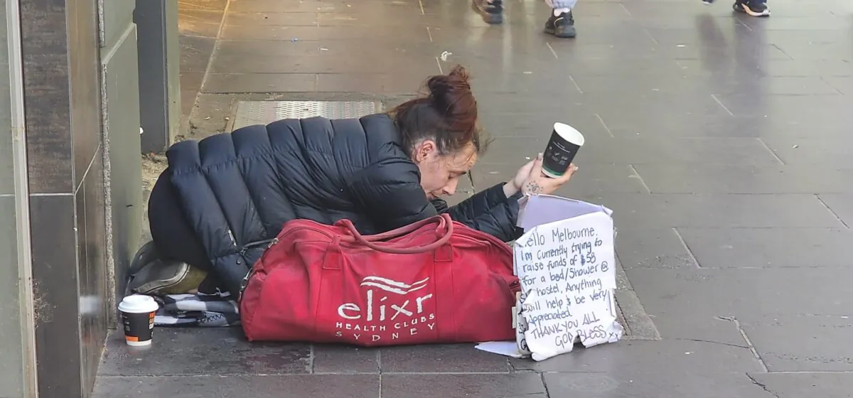 A woman begging in Melbourne, Australia, on Oct. 30, 2023. (Susan Mortimer/The Epoch Times)