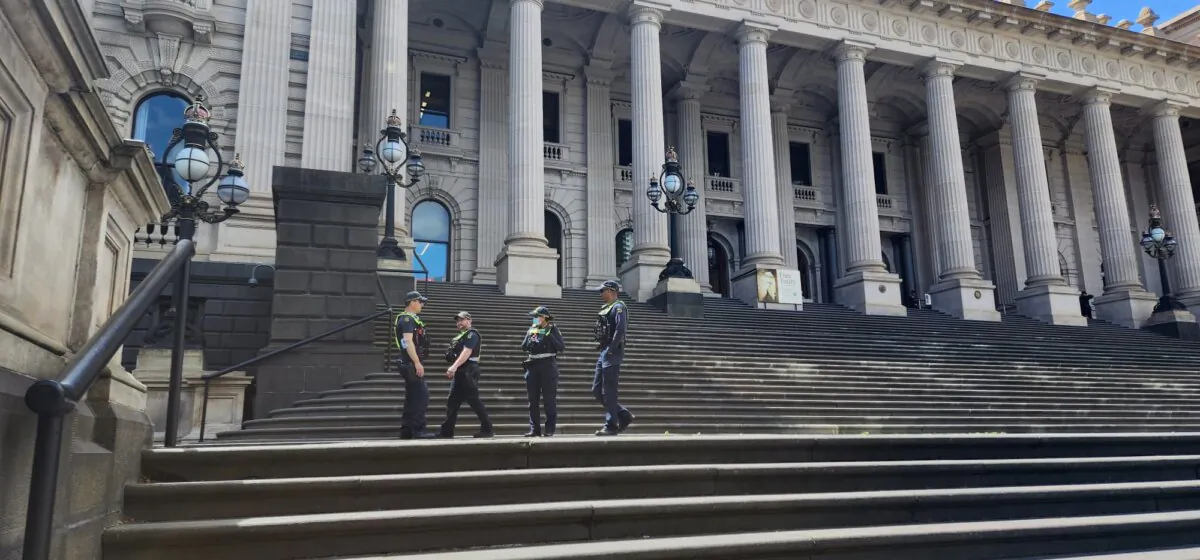 Four Victoria police officer can be seen on the steps of Parliament House in Melbourne, Australia, on Oct. 30, 2023. (Susan Mortimer/The Epoch Times)
