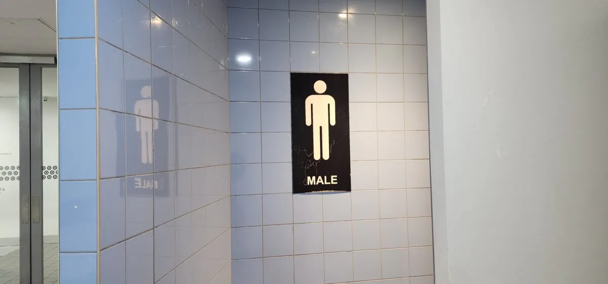 Signage indicating a males-only toilet is seen in Melbourne, Australia, on Oct. 30, 2023. (Susan Mortimer/The Epoch Times)