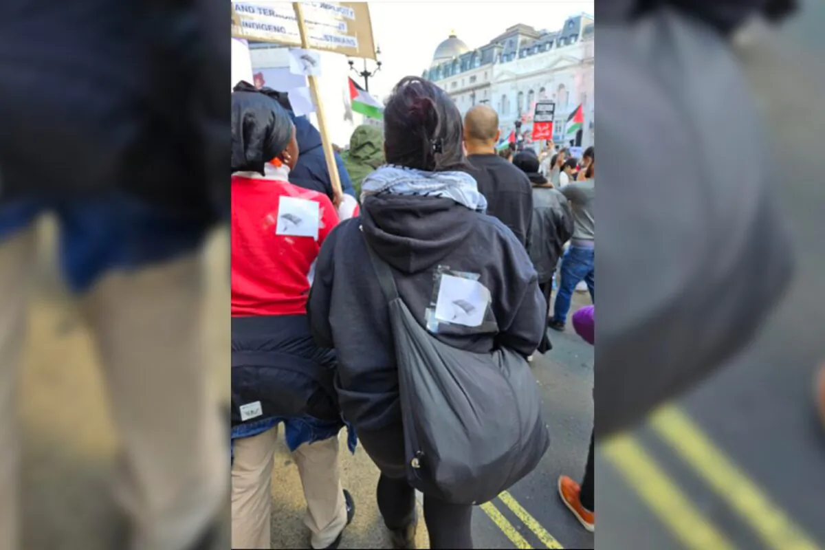 Handout image of two women wanted by the police for displaying images of a paraglider during a pro-Palestitinian rally on Oct. 14, 2023. (The Metropolitan Police)