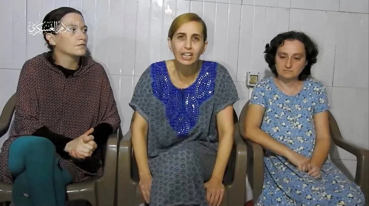 Three Israeli women, identified by Israeli Prime Minister Benjamin Netanyahu as Yelena Trupanob, Danielle Aloni, and Rimon Kirsht, give a statement in this handout video grab obtained by Reuters on Oct. 30, 2023. (Al-Qassam Brigade, Military Wing of Hamas via Telegram/Handout via Reuters)