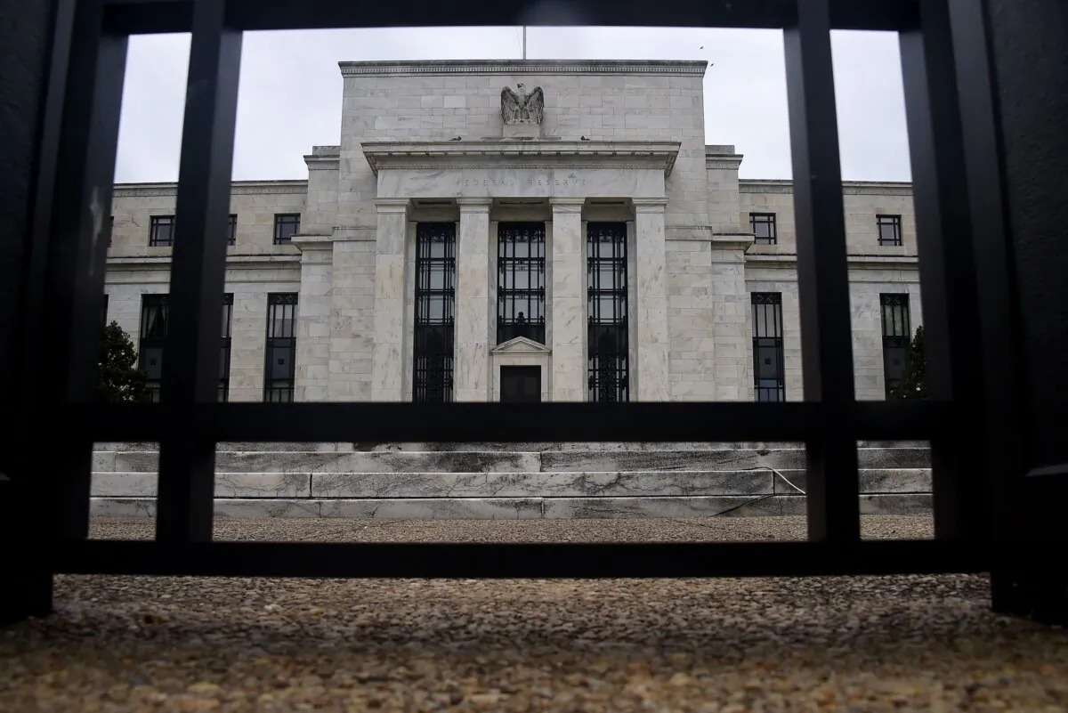 The Federal Reserve building behind a fence in Washington, D.C., on June 17, 2020. (Olivier Douliery/AFP via Getty Images)