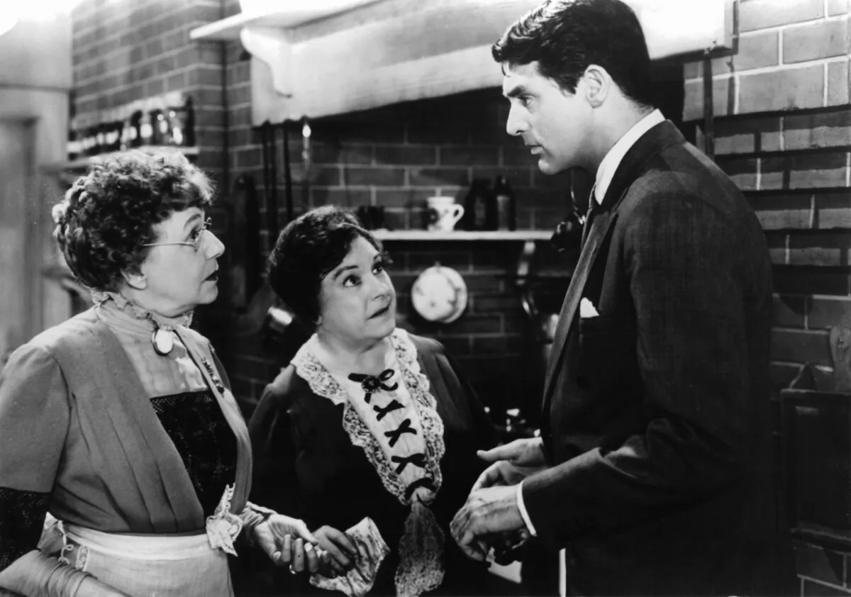(L–R) Aunt Martha Brewster (Jean Adair), Aunt Abby Brewster (Josephine Hull), and Mortimer Brewster (Cary Grant), in “Arsenic and Old Lace.” (Warner Bros.)
