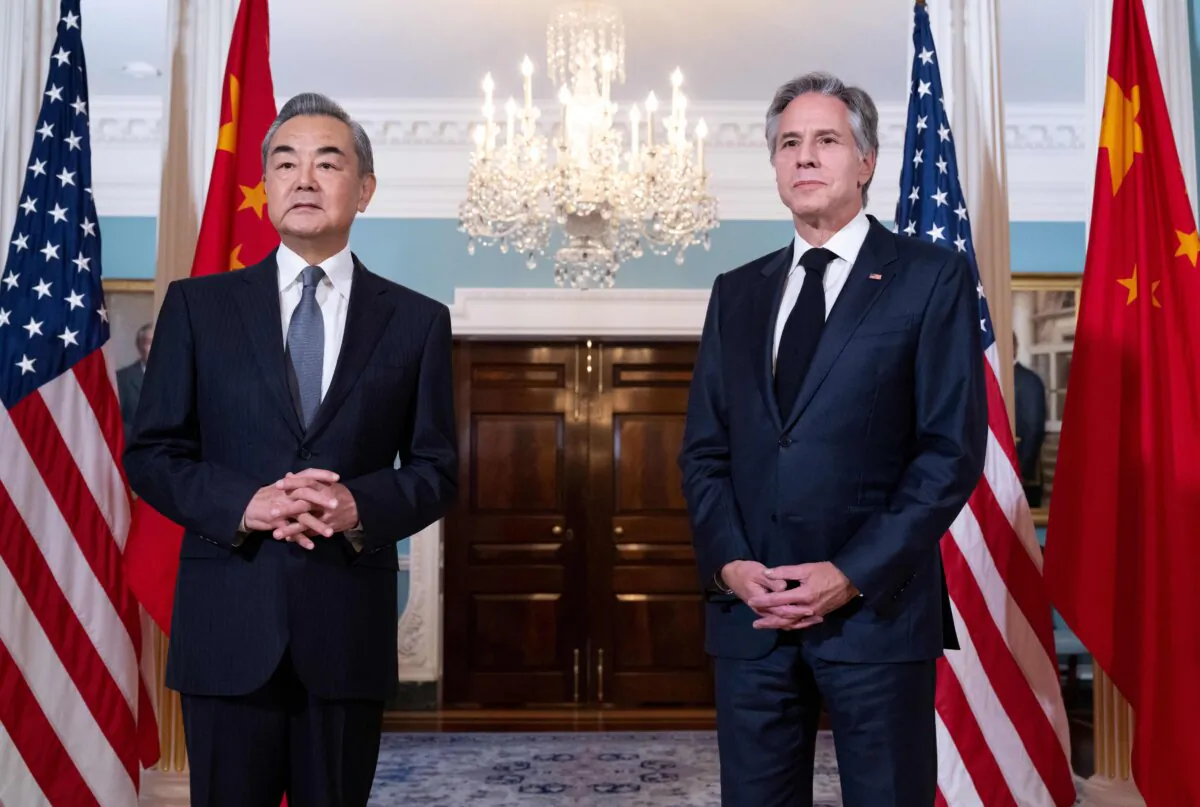 Secretary of State Antony Blinken (R) and Chinese Foreign Minister Wang Yi speak to reporters prior to meetings at the State Department in Washington on Oct. 26, 2023. (Saul Loeb/AFP via Getty Images)