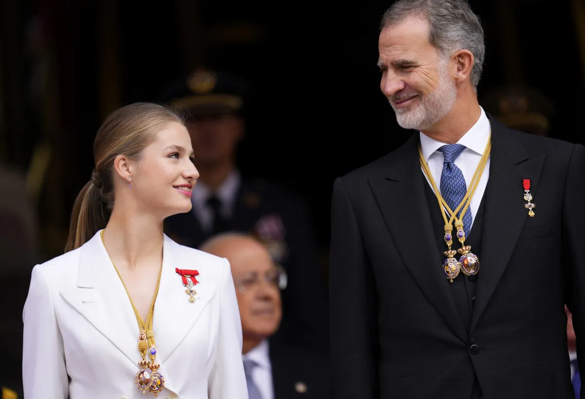 Princess Leonor looks a her father, the Spanish King Felipe VI, as they attend a military parade after swearing allegiance to the Constitution during a gala event that makes her eligible to be queen one day, in Madrid on Oct. 31 2023. (Manu Fernandez/AP Photo)