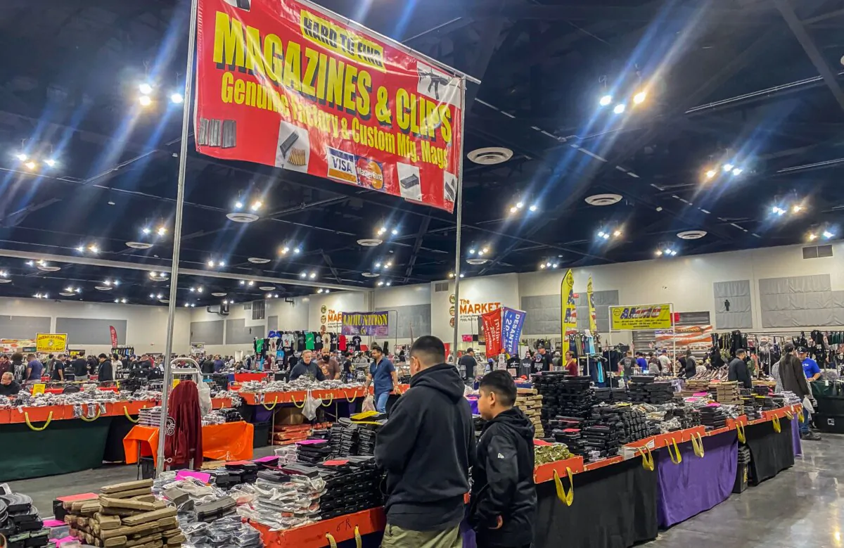 Children look at magazines in a firearms and accessories shop at the Crossroads of the West Gun Show at the Convention Center in Ontario, Calif., on Jan. 28, 2023. (Apu Gomes/AFP via Getty Images)