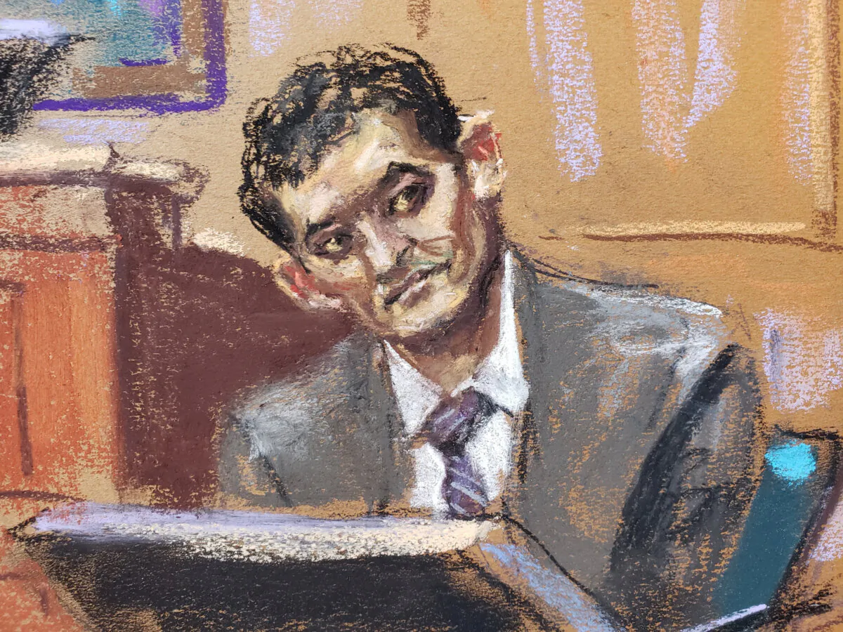 FTX founder Sam Bankman-Fried is questioned by prosecutor Danielle Sassoon (not seen) during his fraud trial over the collapse of the bankrupt cryptocurrency exchange at federal court in New York on Oct. 31, 2023, in a courtroom sketch. (Jane Rosenberg/Reuters)