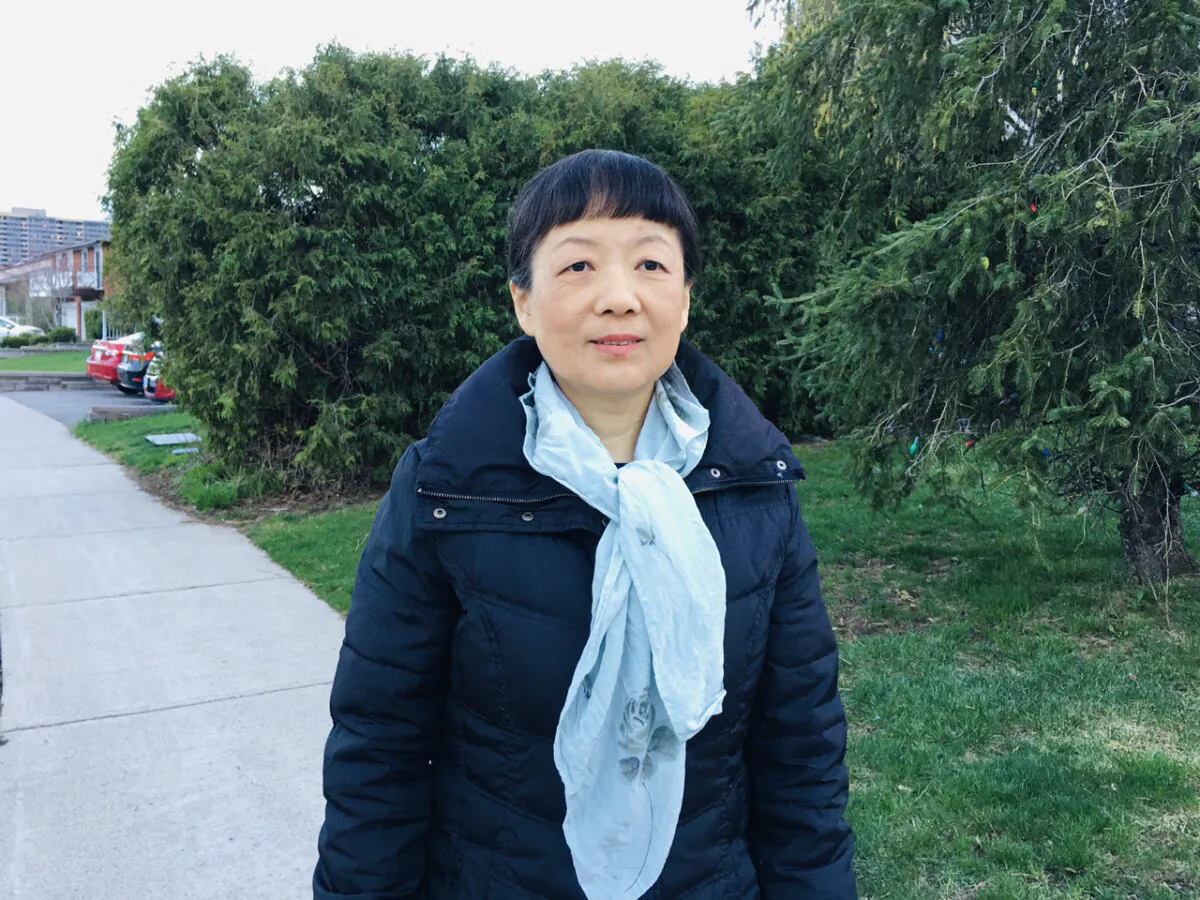 Michelle Zhang, a Falun Gong practitioner who resides in Toronto, poses for a photo on April 19, 2023. Ms. Zhang and her family have experienced years of persecution by the Chinese Communist Party. (Michelle Hu/The Epoch Times)