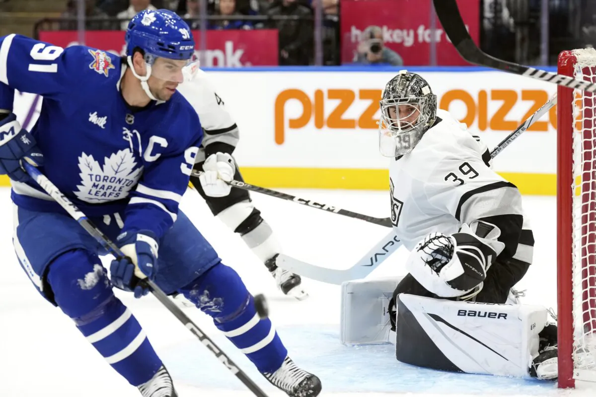 Los Angeles Kings goaltender Cam Talbot looks on as Toronto Maple Leafs' John Tavares goes after a loose puck during the second period of an NHL hockey game in Toronto on Oct. 31, 2023. (Chris Young/The Canadian Press via AP Photo)