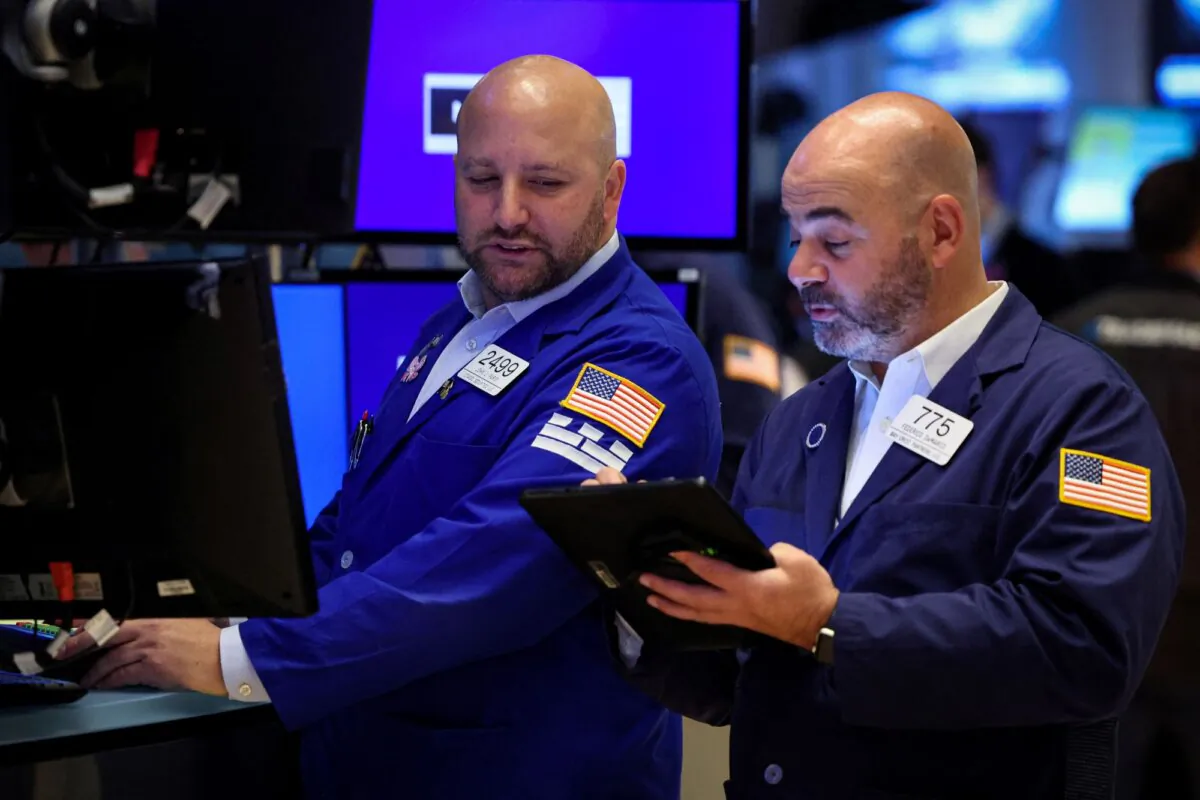 Traders work on the floor at the New York Stock Exchange (NYSE) in New York City on Oct. 27, 2023. (Brendan McDermid/Reuters)
