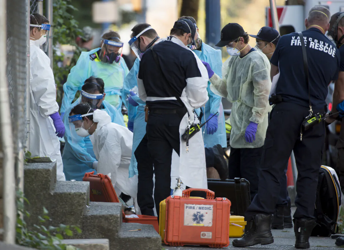Paramedics respond to a drug overdose in Vancouver’s Downtown Eastside on Sept. 10, 2020.  (The Canadian Press/Jonathan Hayward)