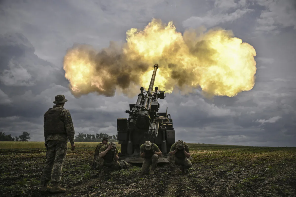 Ukrainian servicemen fire with a French self-propelled 155 mm/52-caliber gun Caesar toward Russian positions at a front line in the eastern Ukrainian region of Donbass on June 15, 2022. (Aris Messinis/AFP via Getty Images)