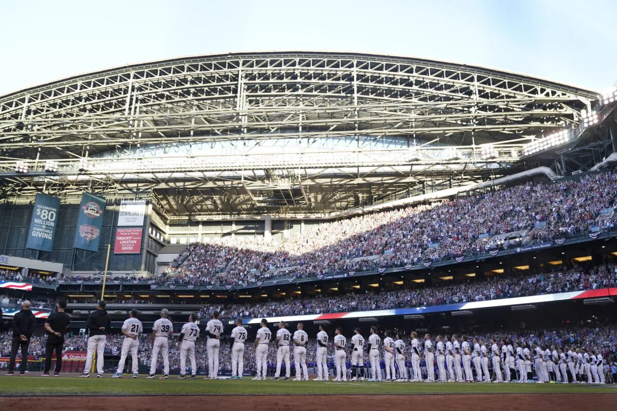 The Arizona Diamondbacks line up for Game 3 of the baseball World Series against the Texas Rangers in Phoenix on Oct. 30, 2023. (Godofredo A. Vásquez/AP Photo)