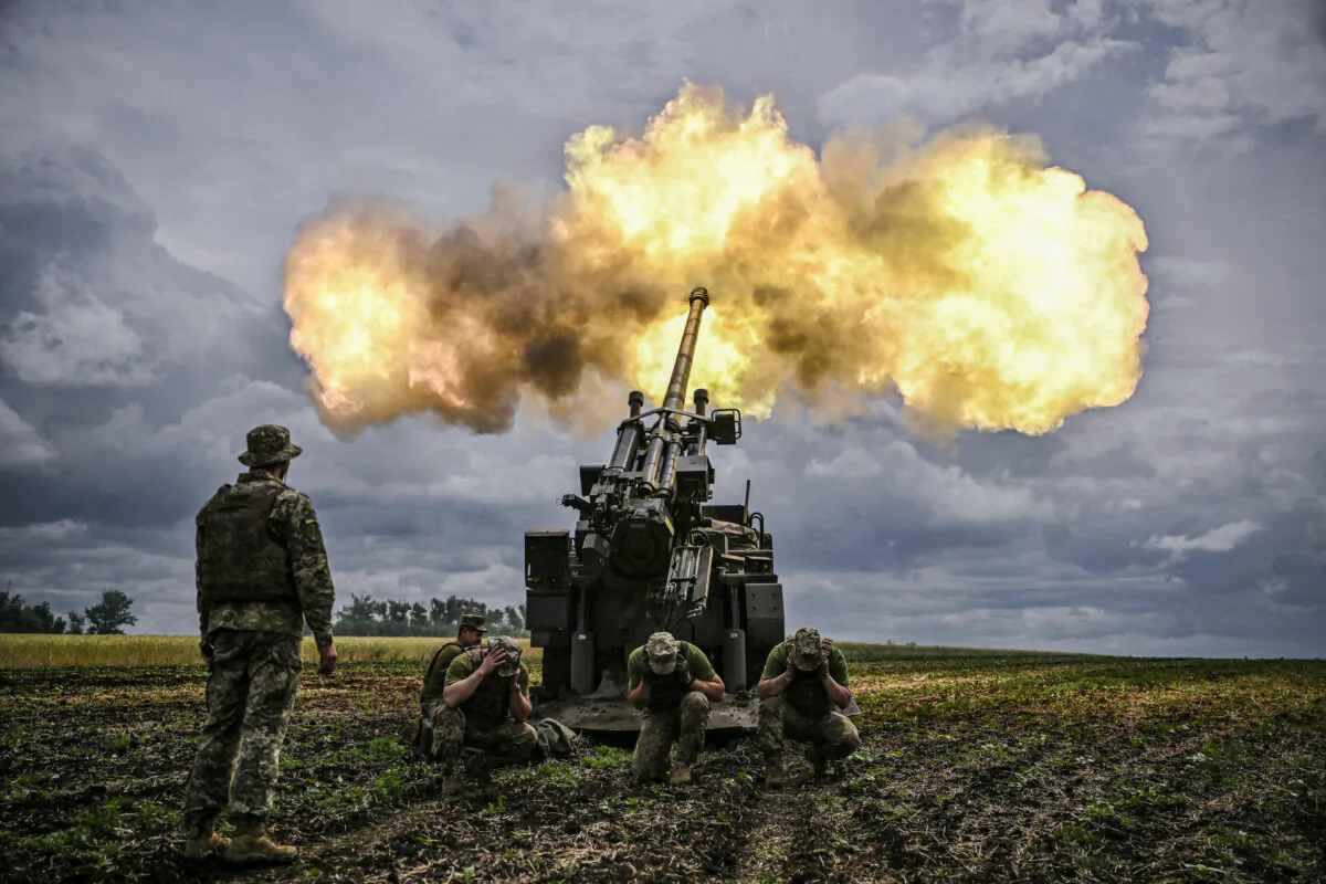 Ukrainian servicemen fire with a French self-propelled 155 mm/52-calibre Caesar gun toward Russian positions at a front line in the eastern Ukrainian region of Donbas on June 15, 2022. (ARIS MESSINIS/AFP via Getty Images)
