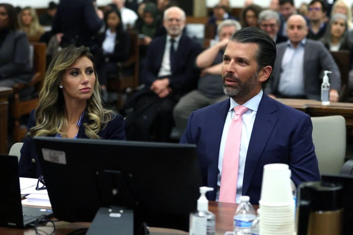 Donald Trump Jr. (R) and lawyer Alina Habba sit in the courtroom for the fraud trial of the Trump Organization in New York City on Nov. 1, 2023. (Mike Segar/Pool/AFP via Getty Images)