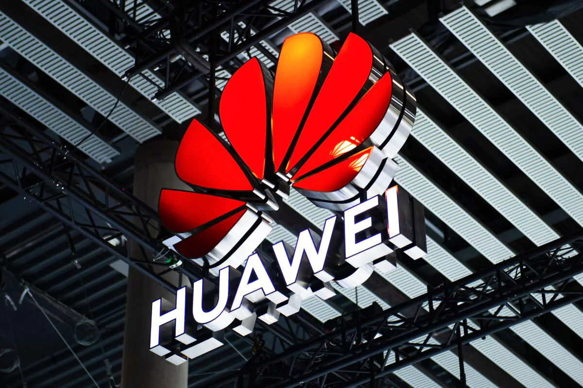 A logo sits illuminated outside the Huawei booth at the SK telecom booth on day 1 of the GSMA Mobile World Congress in Barcelona, Spain, on Feb. 28, 2022. (David Ramos/Getty Images)