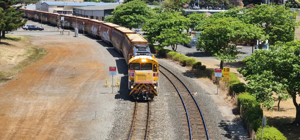 A train pulling carriages full of wood chips for export arrives at port in Albany, Western Australia, on Nov. 2, 2023. (Susan Mortimer/The Epoch Times)